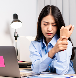 A woman experiencing wrist pain