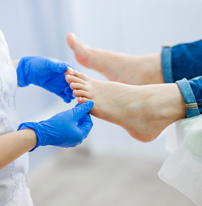 Podiatrist examining a patient's foot